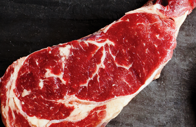 An American Akaushi New York steak. The marbling is much more pronounced than an identical cut of standard rated USDA Prime.